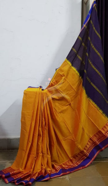 Turmeric yellow mercerised South cotton with temple border and brown pallu