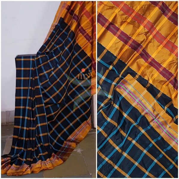 Chequered black kota cotton with woven mustard border and topu teni pallu.