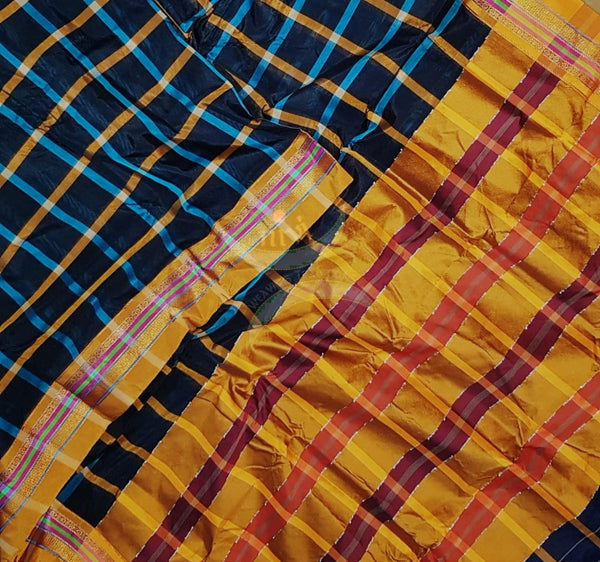 Chequered black kota cotton with woven mustard border and topu teni pallu.