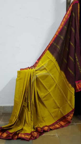 Green mercerised South cotton with contrasting pink woven temple border