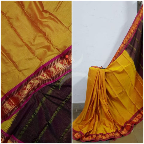 Mustard yellow mercerised South cotton with contrasting pink  woven temple border with elephant motif