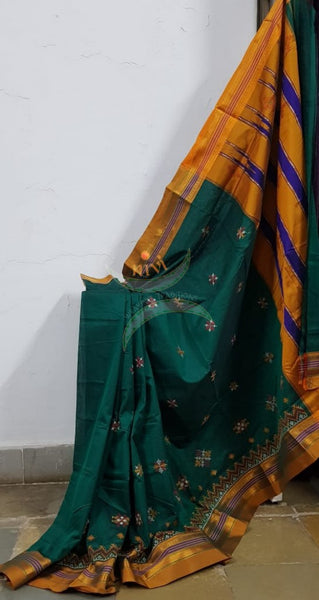Teal ilkal with traditional kasuti machine embroidery.