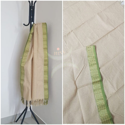 Off white chequared kota cotton dupatta with subtle zari borders.