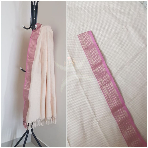 Off white chequared kota cotton dupatta with subtle zari borders.
