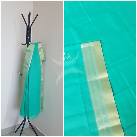 Sea green kota cotton dupatta with subtle gold borders.