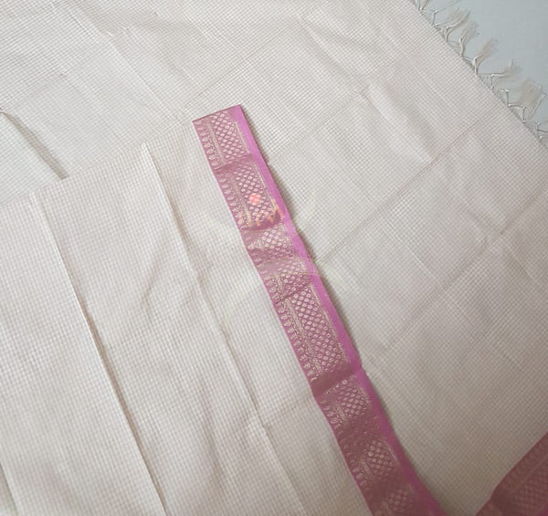 Off white chequared kota cotton dupatta with subtle zari borders.