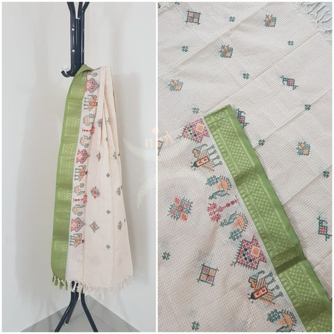 Off white chequared kota cotton dupatta with machine kasuti embroidery.