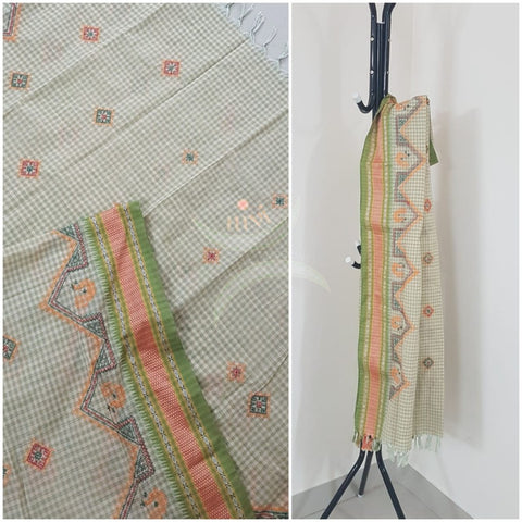 Off white chequared kota cotton dupatta with machine kasuti embroidery.