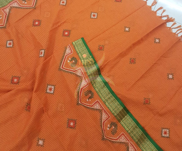 Orange chequared kota cotton dupatta with machine kasuti embroidery.