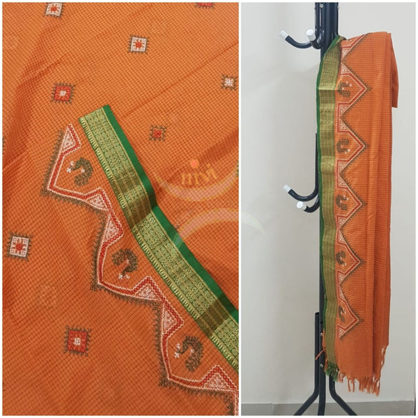 Orange chequared kota cotton dupatta with machine kasuti embroidery.