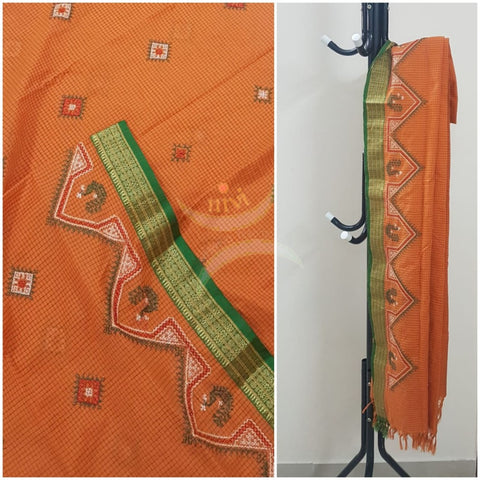 Orange chequared kota cotton dupatta with machine kasuti embroidery.