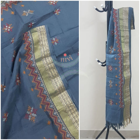 Grey kota cotton dupatta with machine kasuti embroidery.