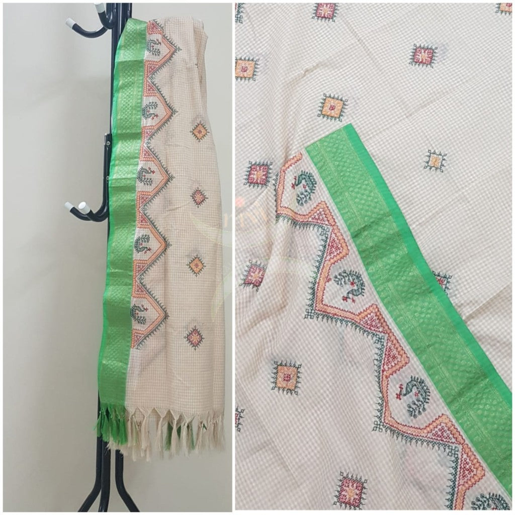 Off white chequared kota cotton dupatta with machine kasuti embroidery.