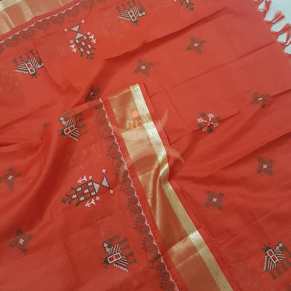 Orange kota cotton dupatta with machine kasuti embroidery.