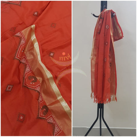 Orange chequared kota cotton dupatta with machine kasuti embroidery.