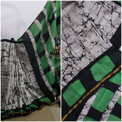 Handloom black and white with contrasting green Chanderi batik saree