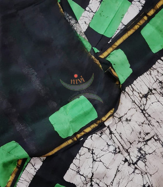 Handloom black and white with contrasting green Chanderi batik saree