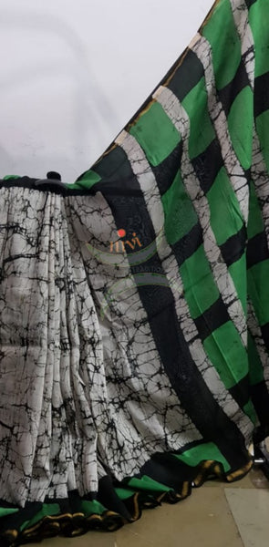 Handloom black and white with contrasting green Chanderi batik saree