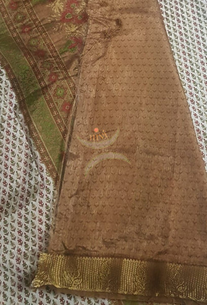 Beige printed art silk saree.  Saree comes with printed blouse piece 