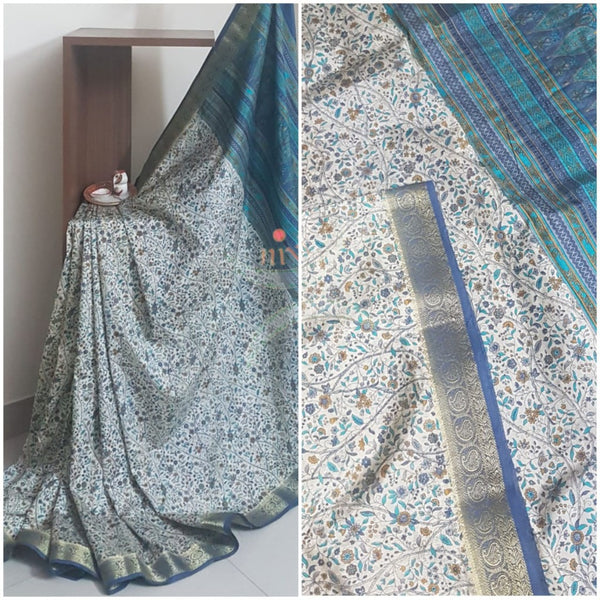 Beige printed art silk saree.  Saree comes with printed blouse piece 