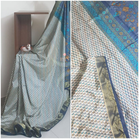 Beige printed art silk saree.  Saree comes with printed blouse piece 