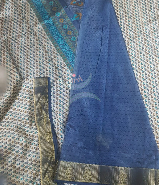 Beige printed art silk saree.  Saree comes with printed blouse piece 