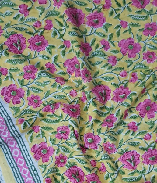 Handloom yellow hand block printed dress material with floral motif and chiffon dupatta.