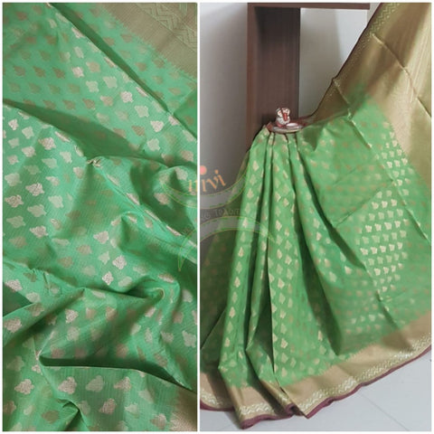 Green silk cotton benaras brocade with antique zari temple border. The saree comes with plain blouse matching body colour.
