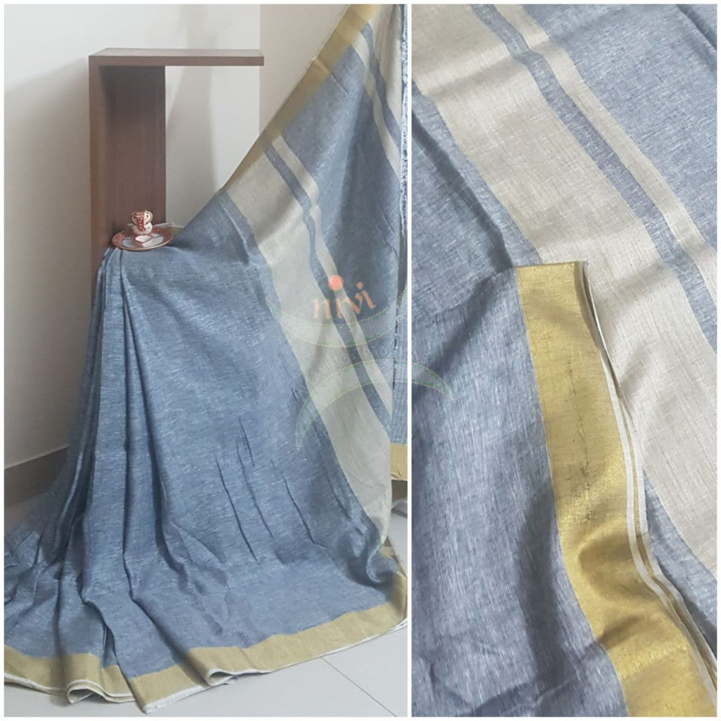Grey linen saree with contrasting gold border