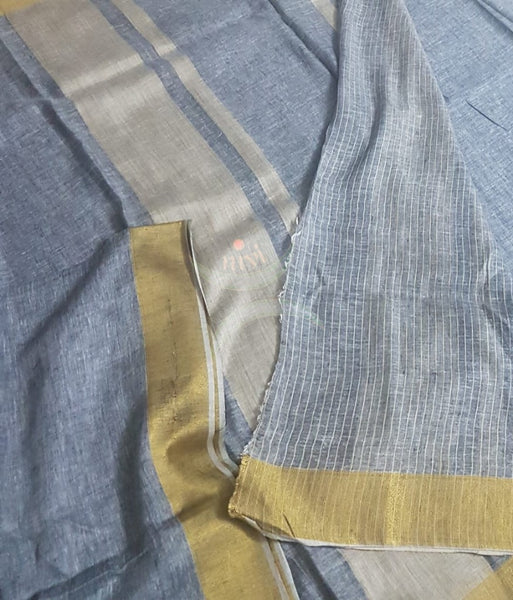Grey linen saree with contrasting gold border