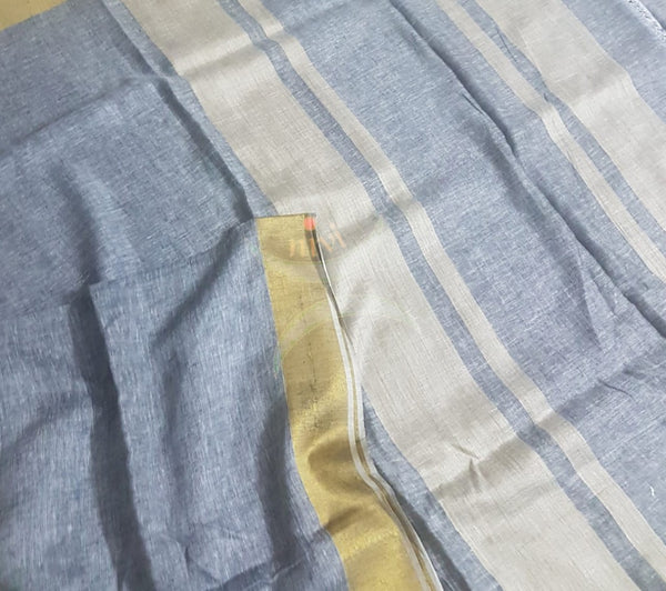 Grey linen saree with contrasting gold border