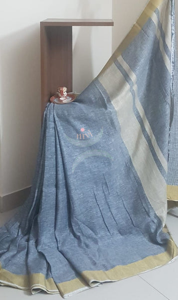 Grey linen saree with contrasting gold border