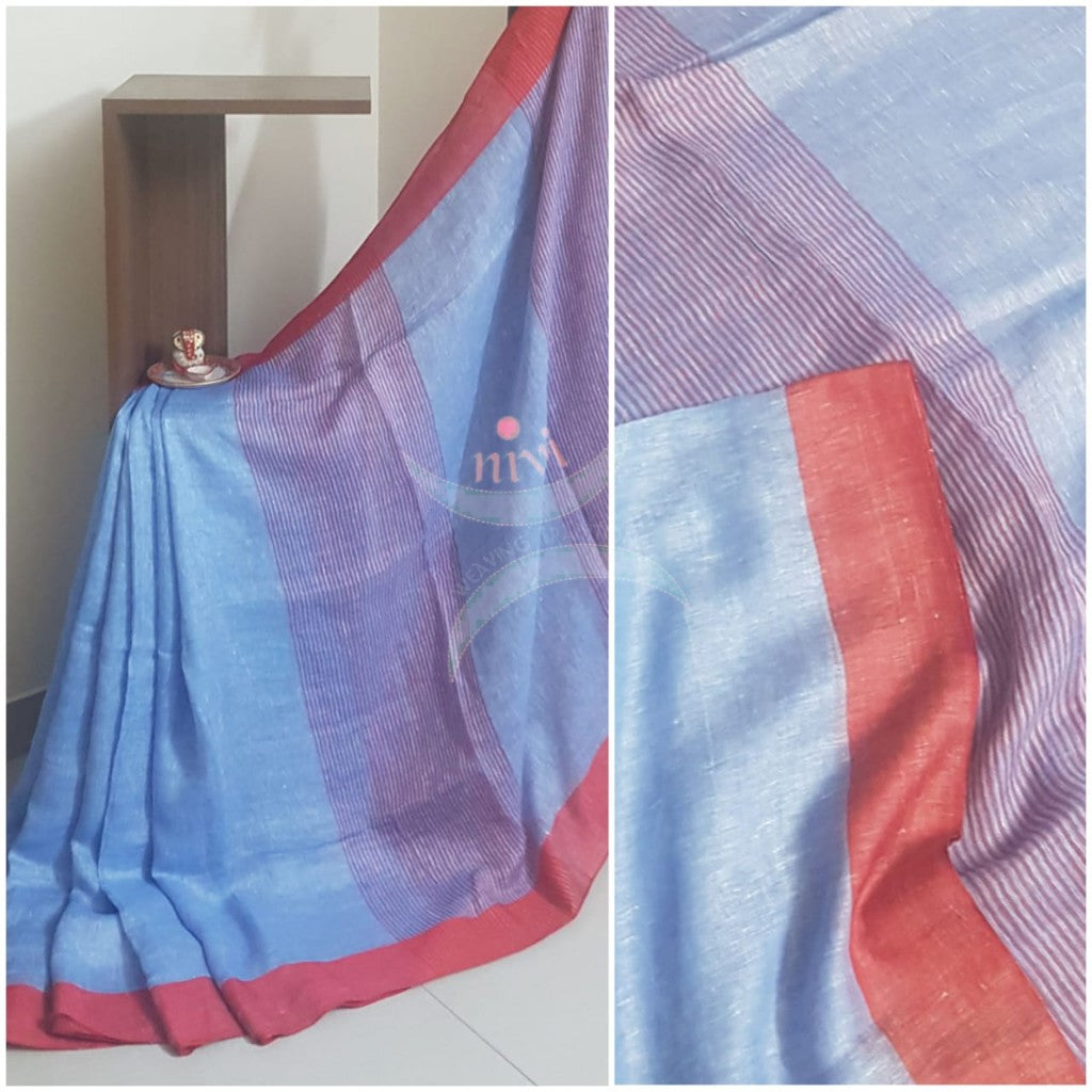 Blue linen saree with contrasting red border