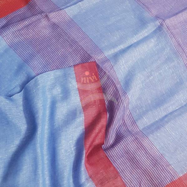 Blue linen saree with contrasting red border