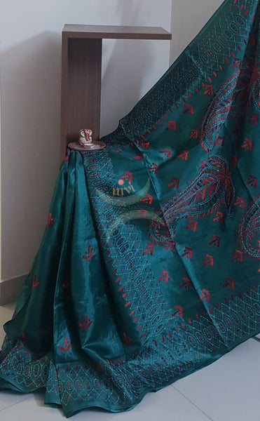 Teal Hand embroidered kantha saree on paper silk with shades of red floral and paisley motif.saree comes with running blouse.