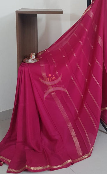 Pink 50 gms pure Silk Crepe with paisley motif fine zari border. Saree comes with pure pink crepe blouse.