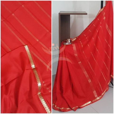 Red 50 gms pure Silk Crepe with paisley motif fine zari border and crepe blouse.