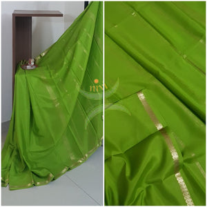 Green 50 gms pure Silk Crepe with paisley motif fine zari border. Saree comes with pure green crepe blouse.