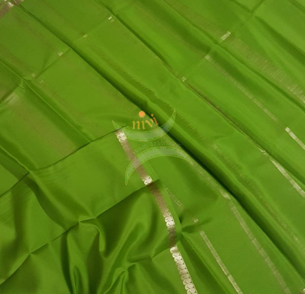 Green 50 gms pure Silk Crepe with paisley motif fine zari border. Saree comes with pure green crepe blouse.