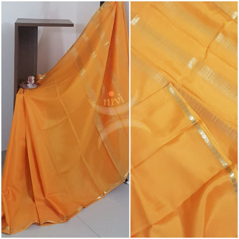 Mustard 50 gms pure Silk Crepe with paisley motif fine zari border. Saree comes with pure mustard crepe blouse.