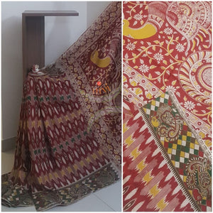 Maroon Cotton handloom kalamkari Saree with ikat effect on body and border, and peacock motif on pallu. Saree comes with kalamkari printed blouse piece.