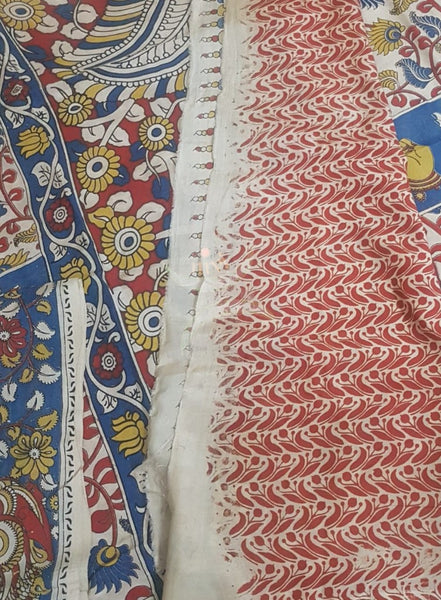 Off white handloom chennur silk kalamkari saree with contrasting blouse piece.