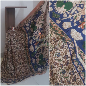 Off white handloom chennur silk kalamkari Saree with hand mudra and floral motifs on body, peacock and floral motif on border and pallu. Saree comes with kalamkari printed blouse piece.