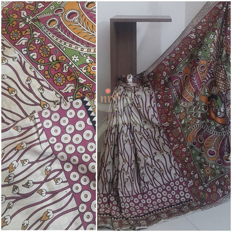 Off white handloom chennur silk kalamkari Saree with floral motifs on body, border and peacock motif on pallu. Saree comes with kalamkari printed blouse piece.