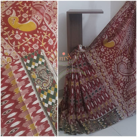 Maroon handloom chennur silk kalamkari Saree with floral motifs on body peacock and floral motif on the border and peacock motif on pallu. Saree comes with kalamkari printed blouse piece.