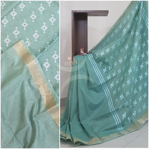 Sea green Handloom linen  with subtle zari border.Saree comes with running blouse.