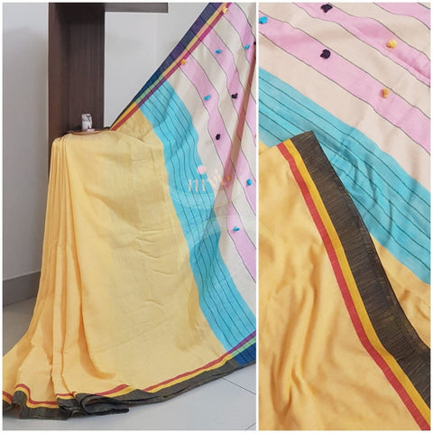 Yellow handloom cotton with contrasting black border, pompoms on pallu and running blouse.