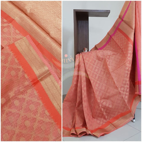 Peachish pink silk cotton benaras brocade with antique zari .