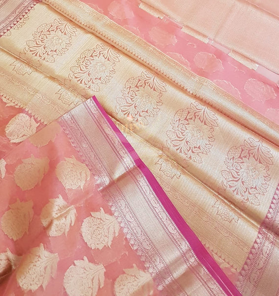 Peachish pink silk cotton benaras brocade with antique zari.