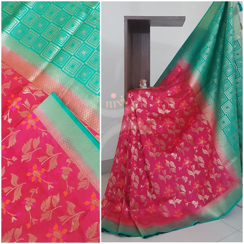 Pink dupion art silk brocade saree with contrast border and pallu.